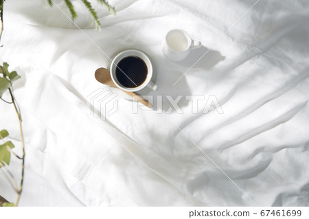 Windowsill with white cloth and coffee cup 67461699