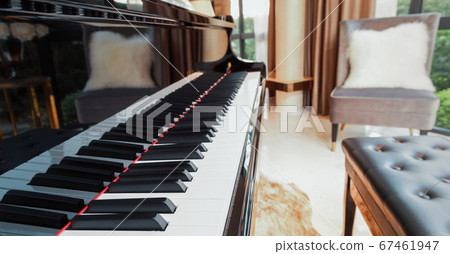 piano keyboard in music living room at modern luxury house, selective focus piano keyboard in music living room at modern luxury house, selective focus 67461947