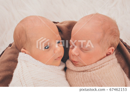 IVF results: The twins embrace. newborn babies sleep together IVF results: The twins embrace. newborn babies sleep together 67462153