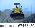 A wheel loader in the mist 67462180