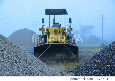 A wheel loader in the mist 67462180