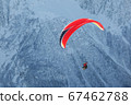 Paraglider in the mountains, winter landscape 67462788