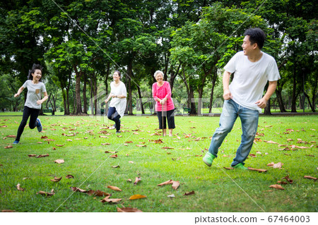 Happy family,asian little child girl or daughter playing tag game,running with father,mother,senior grandmother in summer green nature,dad,mom having fun,play touch and laughing in outdoor park,parent Happy family,asian little child girl or daughter playing tag game,running with father,mother,senior grandmother in summer green nature,dad,mom having fun,play touch and laughing in outdoor park,parent 67464003