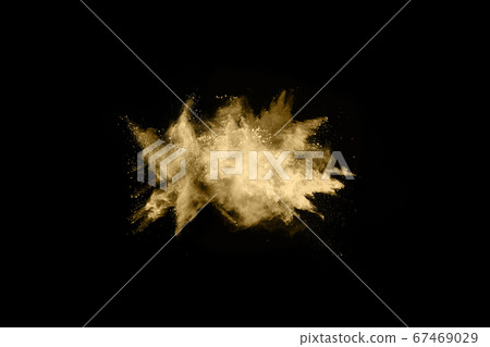 Golden powder explosion on black background. Freeze motion. 67469029