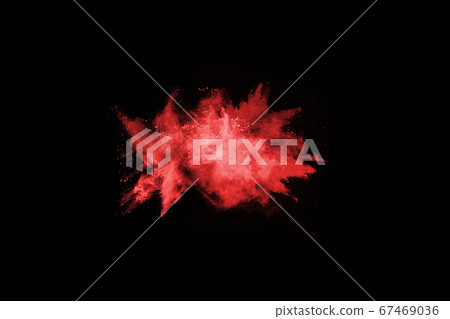abstract red powder explosion on black background.abstract red powder splatted on black background. Freeze motion of red powder exploding. 67469036