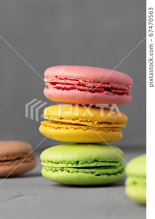 Colorful macaroon cookies on grey surface close up 67470563