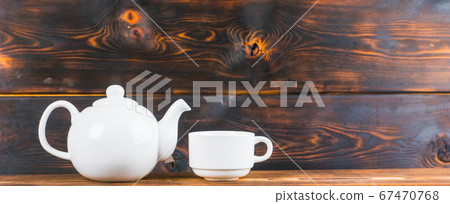 tea cup and pot on rustic wooden table, panoramic 67470768