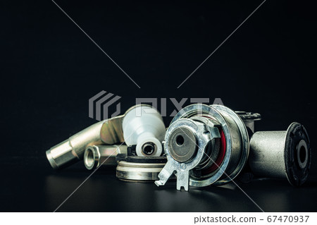 Metal car engine spare part on black background 67470937