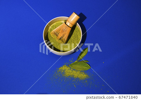 Matcha tea. A traditional oriental drink for health and energy. Powdered green tea and whisk Matcha tea. A traditional oriental drink for health and energy. Powdered green tea and whisk 67471840