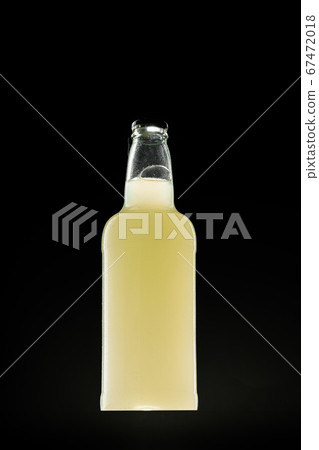 Beer bottle on dark background, copy space Beer bottle on dark background, copy space 67472018