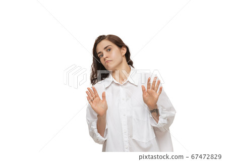 Young caucasian woman with funny, unusual popular emotions and gestures isolated on white studio background 67472829