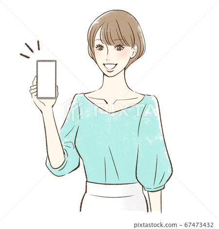 A woman who smiles and shows the screen of her smartphone here 67473432