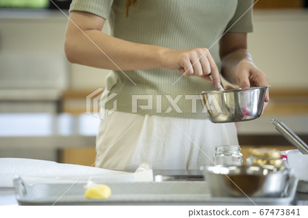 Woman making sweets Woman making sweets 67473841