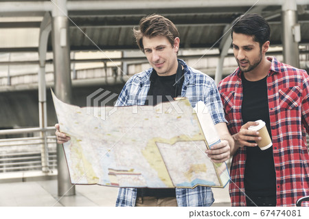 Two traveler handsome guys searching for direction Two traveler handsome guys searching for direction 67474081