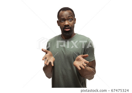 Young african-american man with funny, unusual popular emotions and gestures isolated on white studio background 67475324