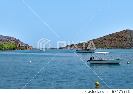 View of lagoon with anchored fishermen's boats on a sunny summer day on Crete island, Greece 67475538
