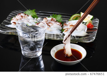 Shochu and raw octopus sashimi 67476651
