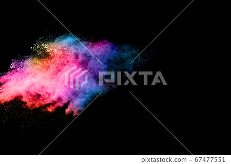 abstract colored dust explosion on a black background.abstract powder splatted background,Freeze motion of color powder exploding/throwing color powder, multicolored glitter texture. 67477551