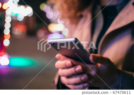 Young elegant woman using mobile phone Young elegant woman using mobile phone 67478611