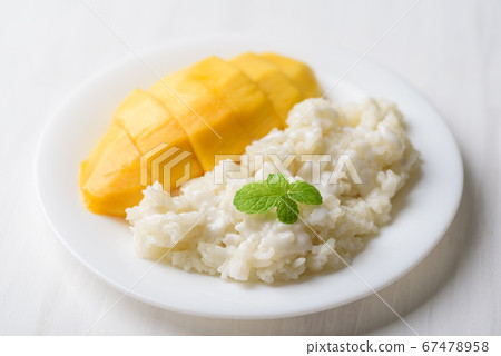 Mango sticky rice on plate with white table, Thai dessert (Khao Niew Ma Muang) Mango sticky rice on plate with white table, Thai dessert (Khao Niew Ma Muang) 67478958