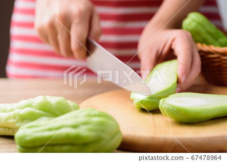 Chayote squash or Mirlition squash chopping for cooking 67478964