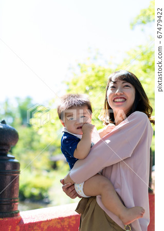 Boy and mother playing in the park 10 months Boy and mother playing in the park 10 months 67479422