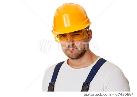 portrait of caucasian man construction worker in yellow hard hat portrait of caucasian man construction worker in yellow hard hat 67480694