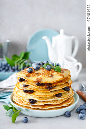 Blueberry pancakes with butter, maple syrup and 67481631