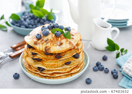 Blueberry pancakes with butter, maple syrup and 67481632