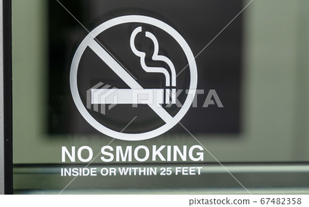No Smoking sign on a glass surface No Smoking sign on a glass surface 67482358