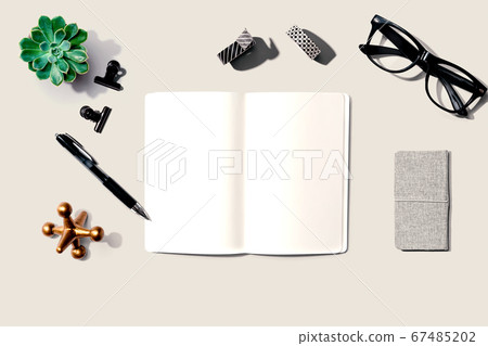 Notebook with office supplies Notebook with office supplies 67485202