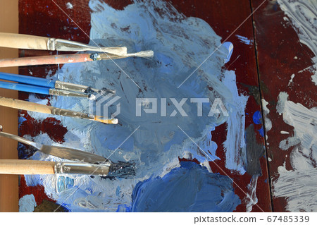Paintbrushes and palette. Paintbrushes and palette. 67485339