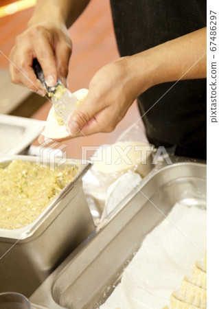 Hands to wrap dumplings Hands to wrap dumplings 67486297