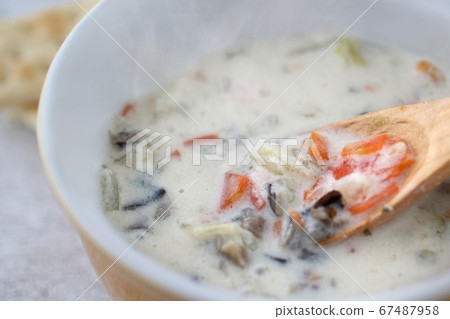 Vegan menu of milk flavored chowder with vegetables and wild rice 67487958