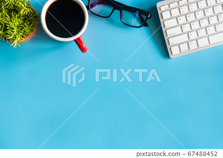 Pastel blue desk office with laptop, smartphone Pastel blue desk office with laptop, smartphone 67488452