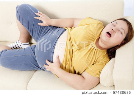 Metabo woman sleeping on the sofa Metabo woman sleeping on the sofa 67488686