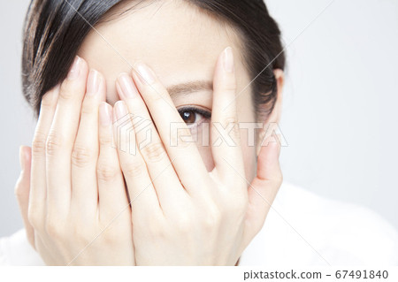 Woman covering face Woman covering face 67491840