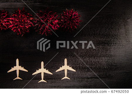 Line of grounded toy planes with COVID-19 virus 67492050