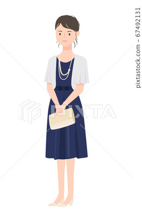 A cute woman wearing a bolero over her dress. 67492131