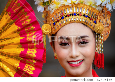 Indonesian girl with traditional costumn dance in 67493156