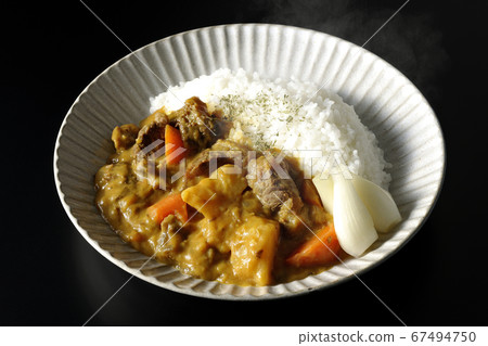 Hot curry rice with plenty of potatoes, carrots and beef tendon meat taken on a black background 67494750