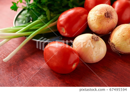 healthy food - fresh vegetables and greens on a healthy food - fresh vegetables and greens on a 67495594