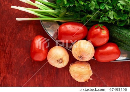 healthy food - fresh vegetables and greens on a healthy food - fresh vegetables and greens on a 67495596