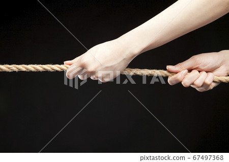 Hand holding a rope Hand holding a rope 67497368
