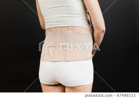 Back view of pregnant woman wearing pregnancy Back view of pregnant woman wearing pregnancy 67498115