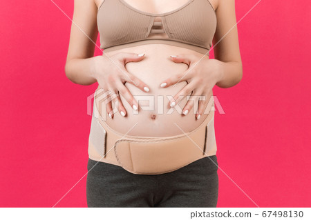 Close up of pregnancy bandage dressed on pregnant Close up of pregnancy bandage dressed on pregnant 67498130