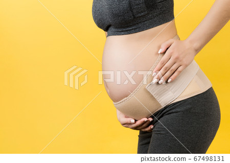 Cropped image of pregnancy belt dressed on Cropped image of pregnancy belt dressed on 67498131