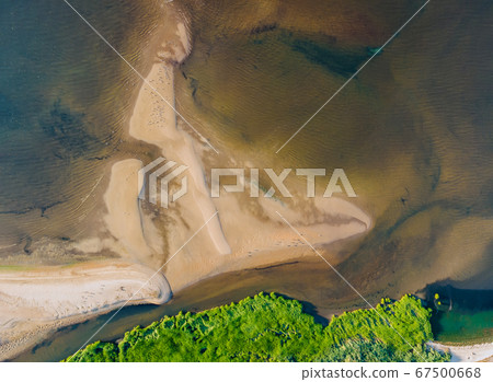 Yellow sandy beach with waves on blue sea view Yellow sandy beach with waves on blue sea view 67500668