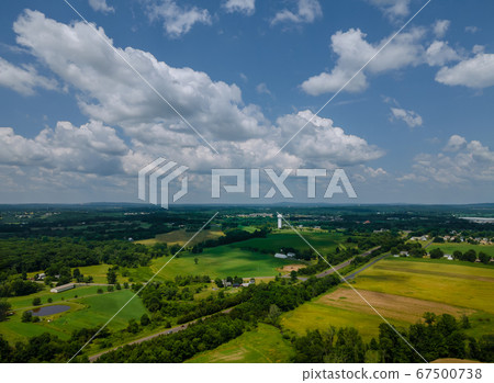 Green and yellow field from a great height in 67500738
