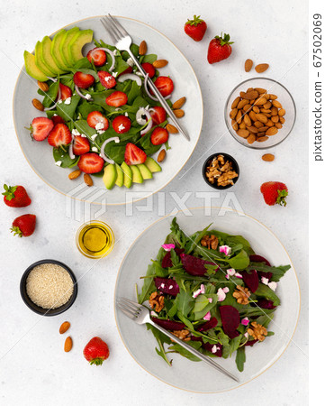 Summer vegetarian salad in a gray plate on table 67502069